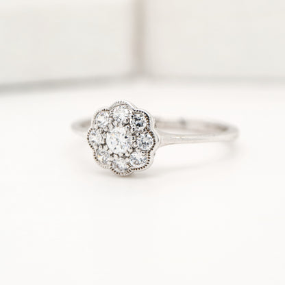 Dainty daisy diamond ring in white gold