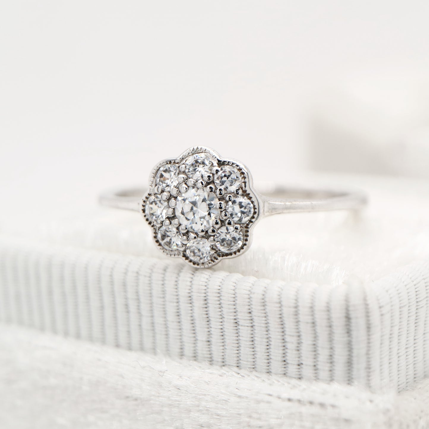 Dainty daisy diamond ring in white gold