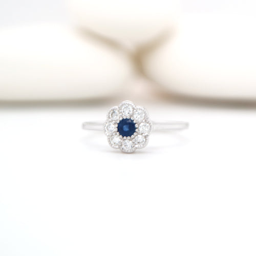Dainty daisy ring with natural sapphire and diamond in 9k white gold