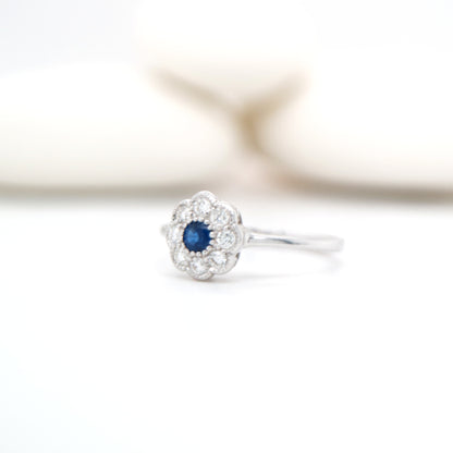 Dainty daisy ring with natural sapphire and diamond in 9k white gold