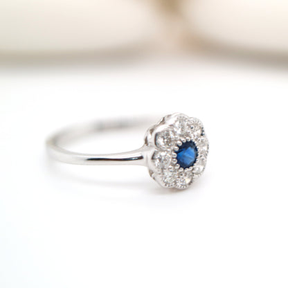 Dainty daisy ring with natural sapphire and diamond in 9k white gold