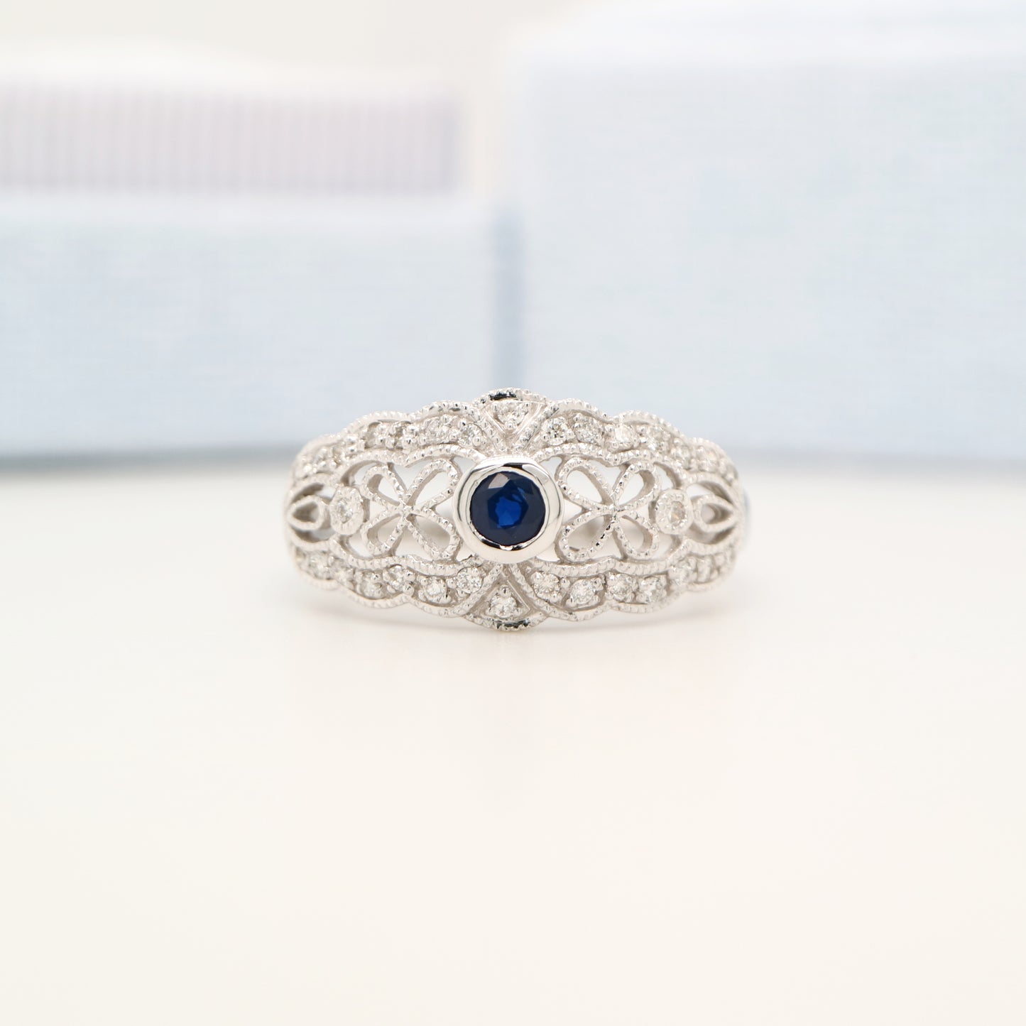 White gold lace art deco ring with sapphire and diamonds