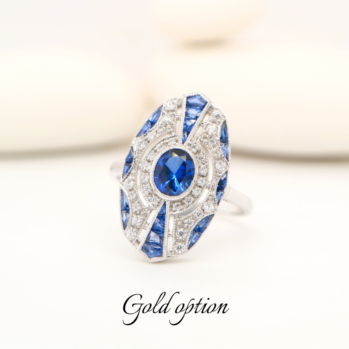 9k white gold shield ring with sapphire and diamond