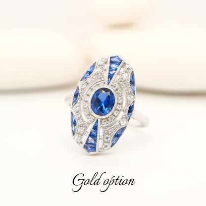 9k white gold shield ring with sapphire and diamond