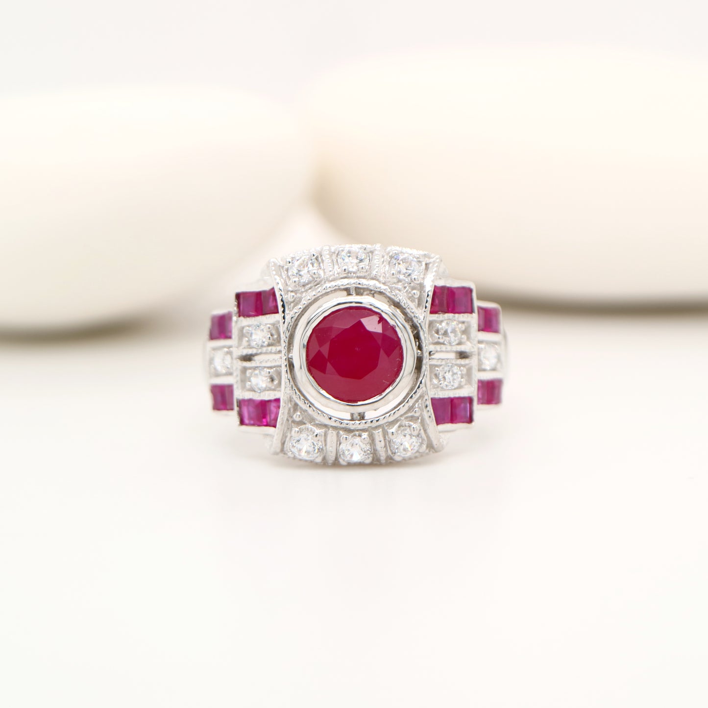 Art deco cocktail ring with ruby and diamond in 9k white gold