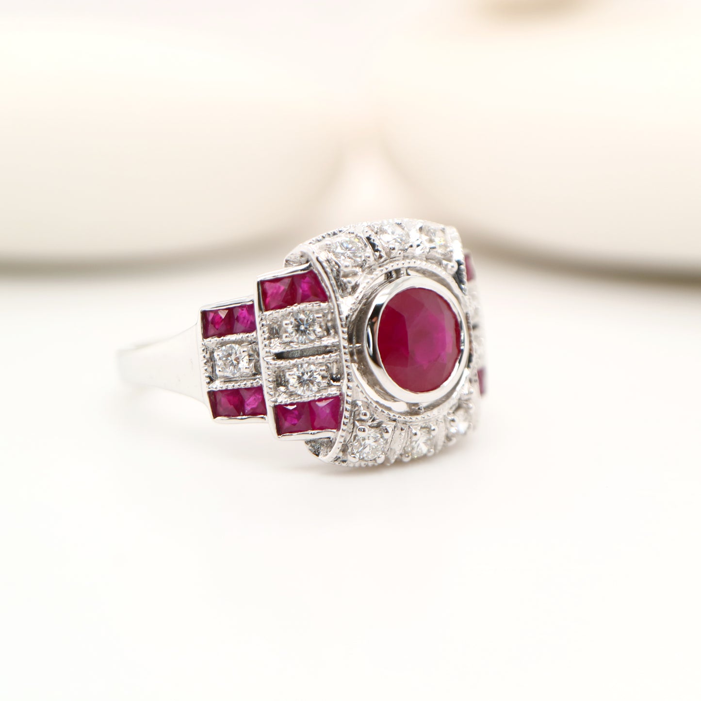 Art deco cocktail ring with ruby and diamond in 9k white gold