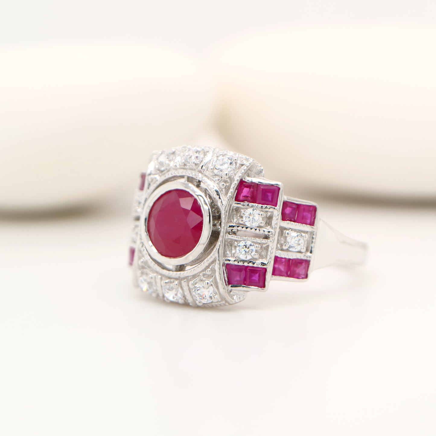 Art deco cocktail ring with ruby and diamond in 9k white gold