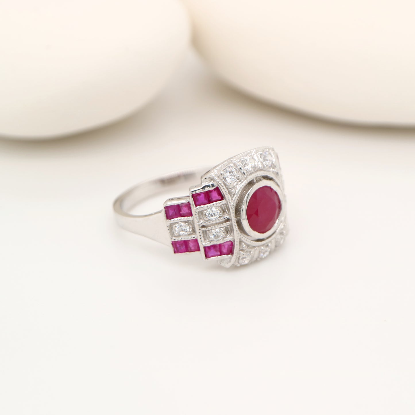 Art deco cocktail ring with ruby and diamond in 9k white gold