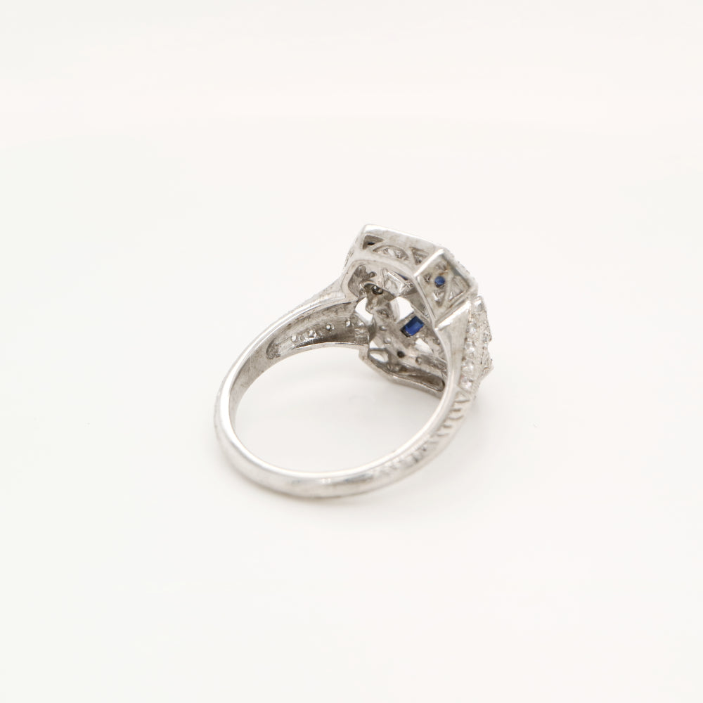 Diamond shield ring with sapphire accents in white gold