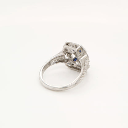 Diamond shield ring with sapphire accents in white gold