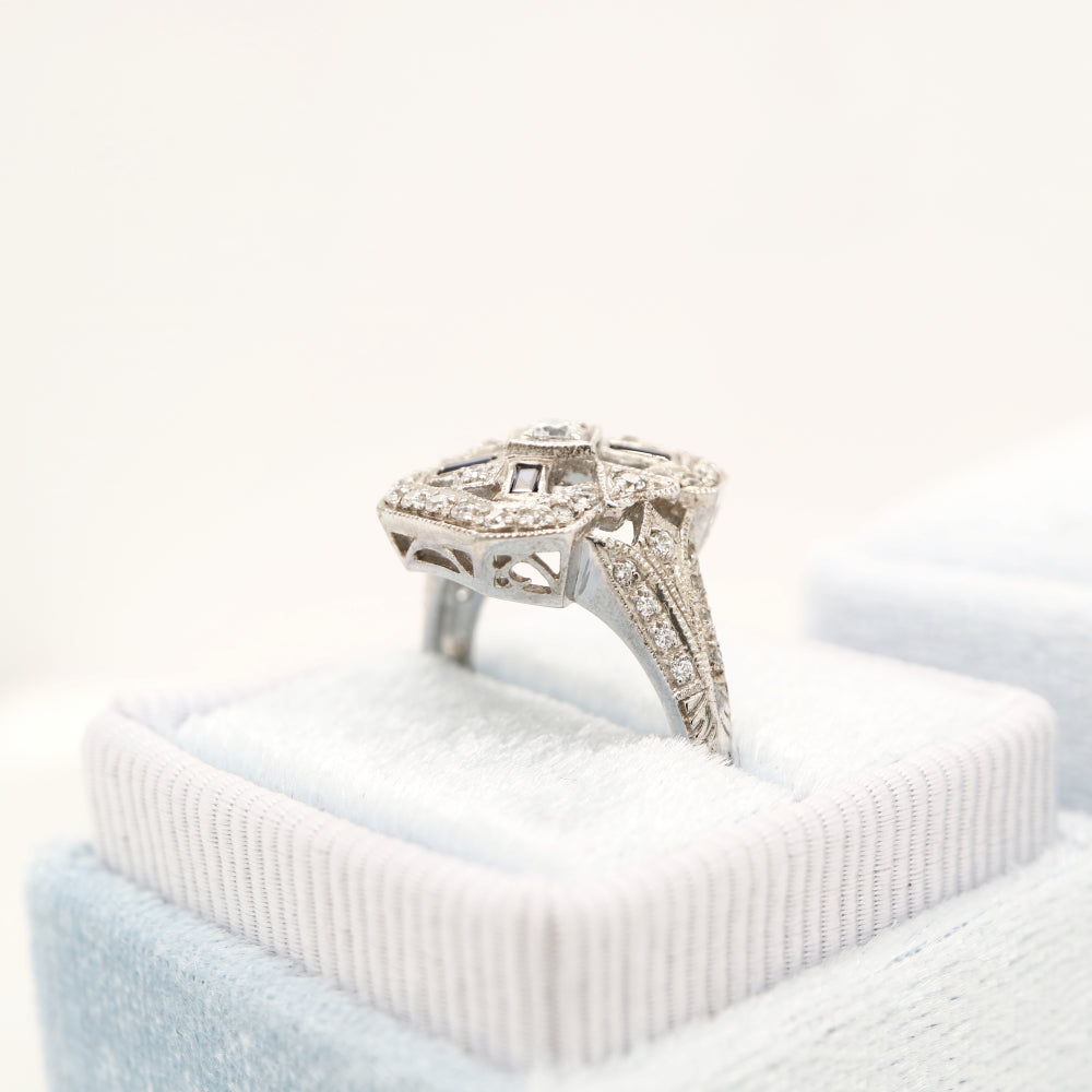 Diamond shield ring with sapphire accents in white gold