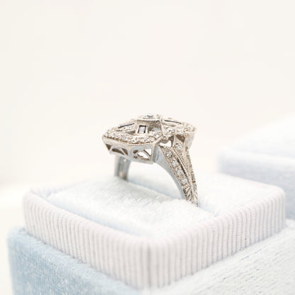 Diamond shield ring with sapphire accents in white gold