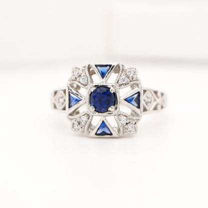 Vintage ring with laboaratory grown sapphire and cz in sterling silver
