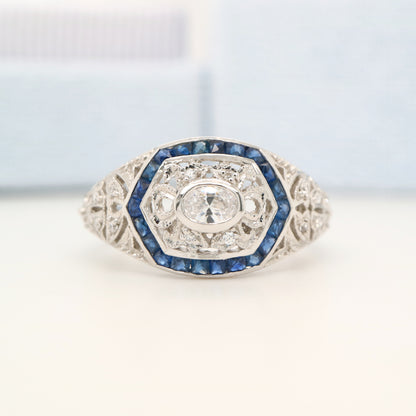 Art deco white gold ring with diamond and sapphire halo