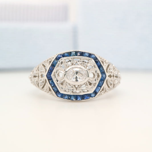 Art deco white gold ring with diamond and sapphire halo