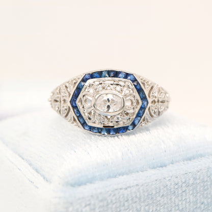 Art deco white gold ring with diamond and sapphire halo