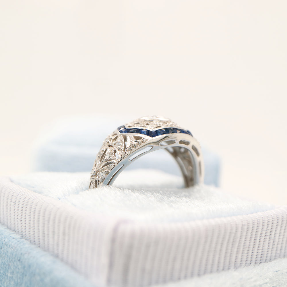 Art deco white gold ring with diamond and sapphire halo