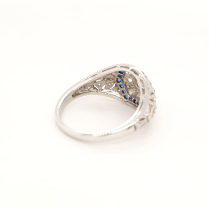Art deco white gold ring with diamond and sapphire halo