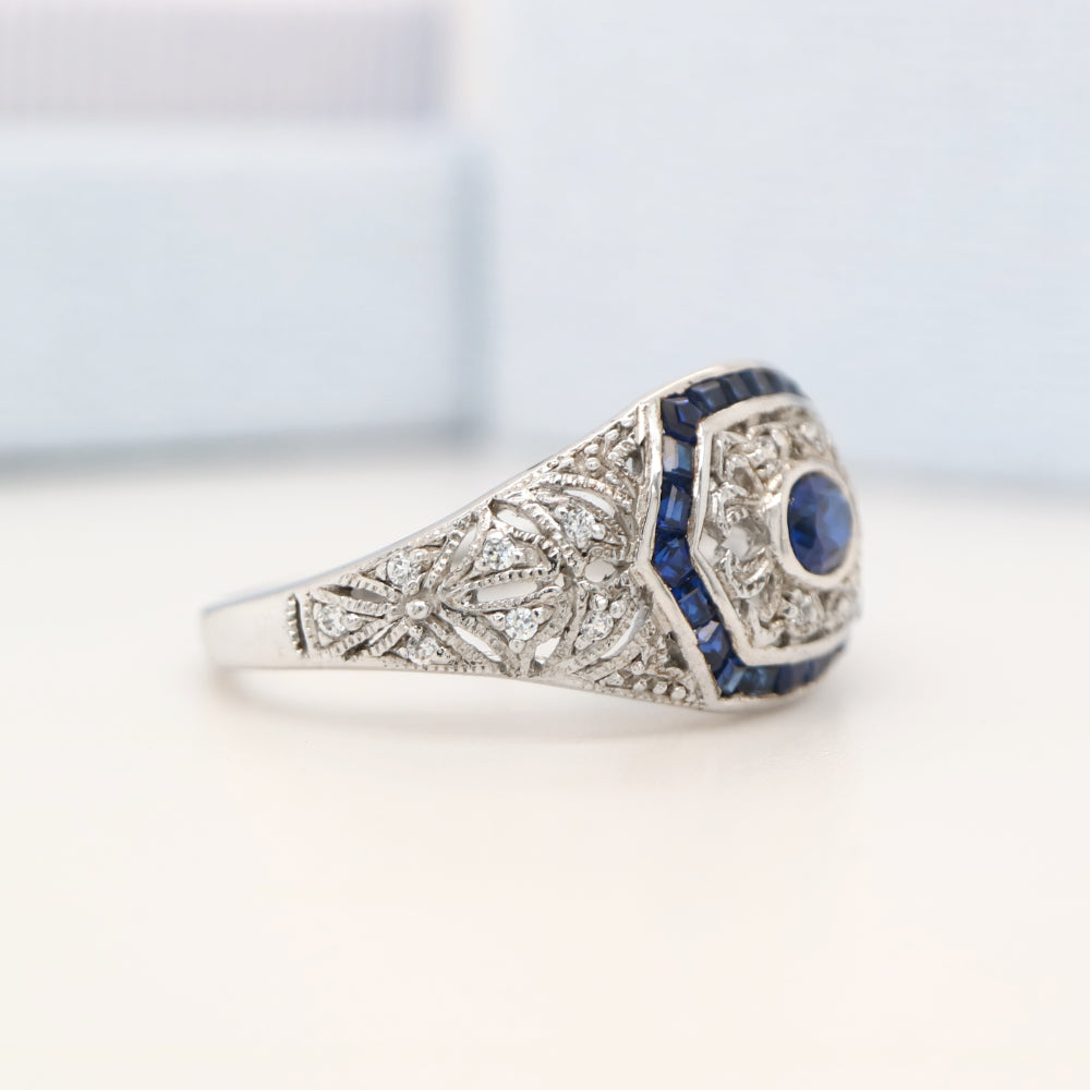 Art deco white gold ring with sapphire and diamond halo  - sapphire centre stone