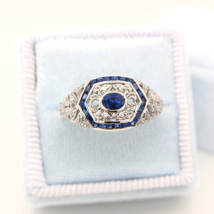 Art deco white gold ring with sapphire and diamond halo  - sapphire centre stone