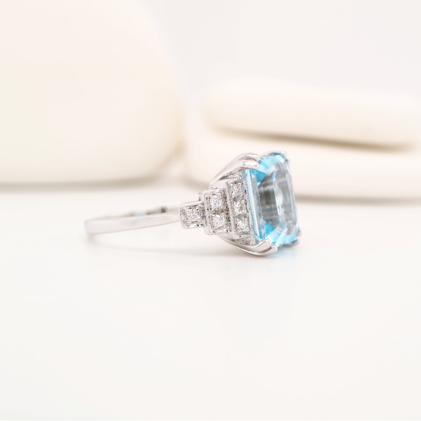 Blue topaz solitaire with diamonds in white gold
