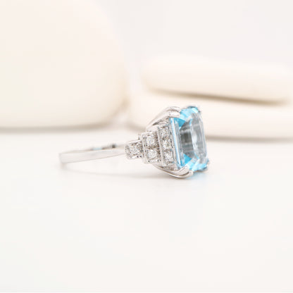 Blue topaz solitaire with diamonds in white gold