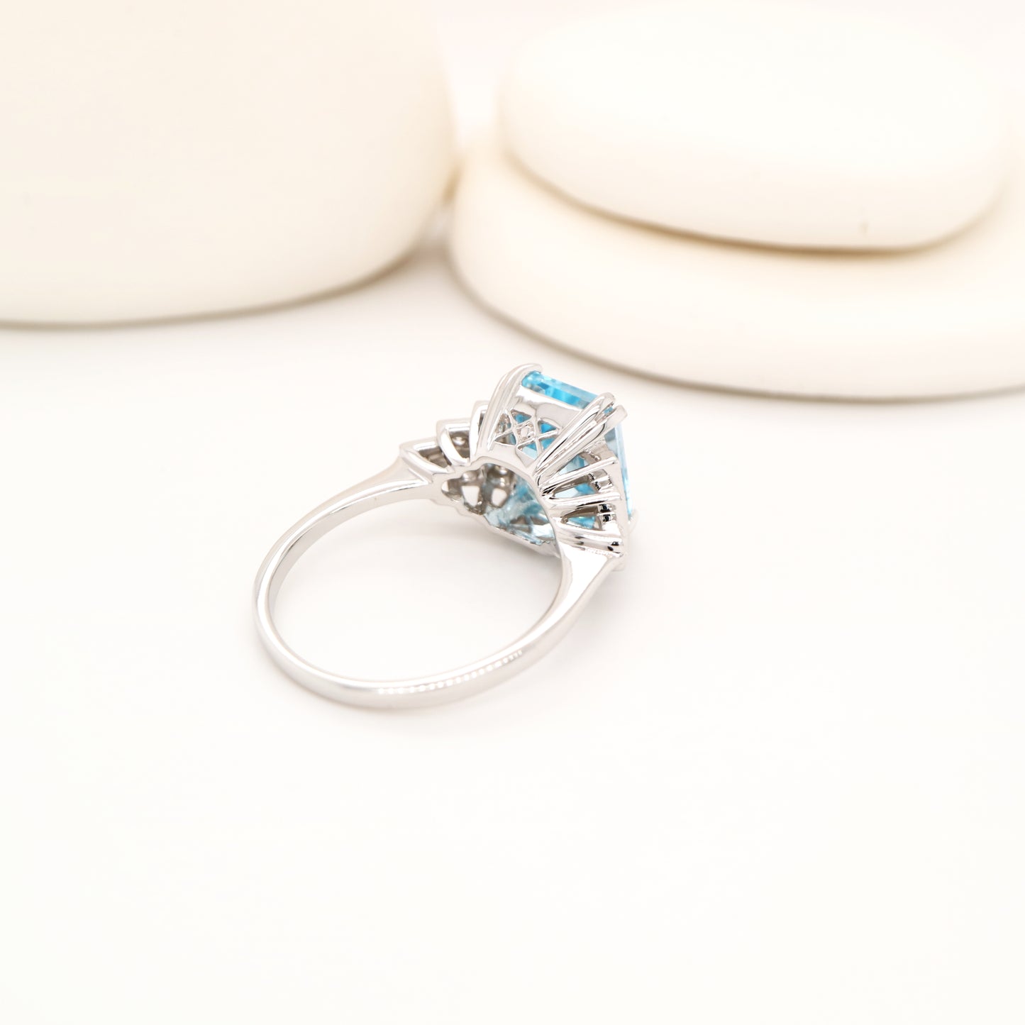 Blue topaz solitaire with diamonds in white gold