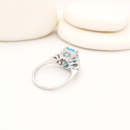 Blue topaz solitaire with diamonds in white gold
