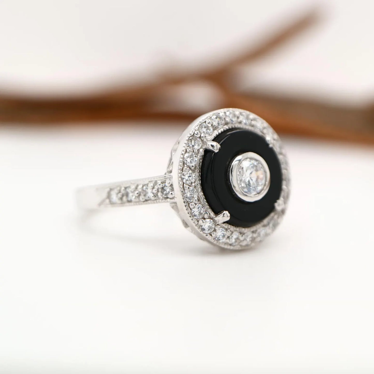 Round art deco style diamond and black onyx ring in white gold