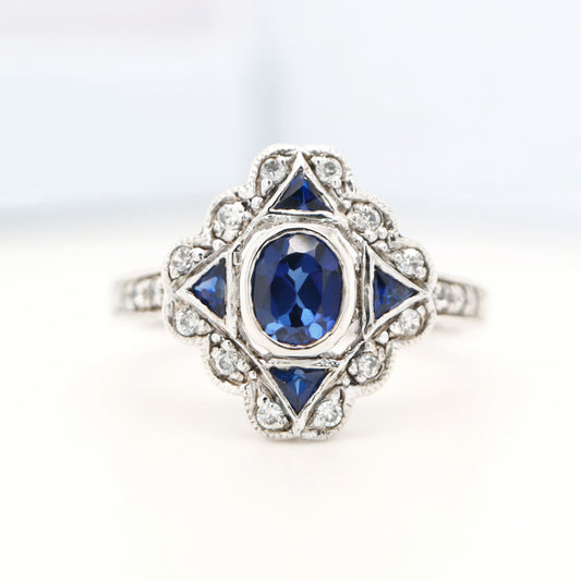 Art deco sapphire starburst white gold ring with diamond halo