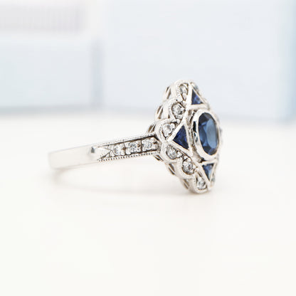 Art deco sapphire starburst white gold ring with diamond halo