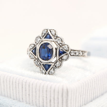 Art deco sapphire starburst white gold ring with diamond halo