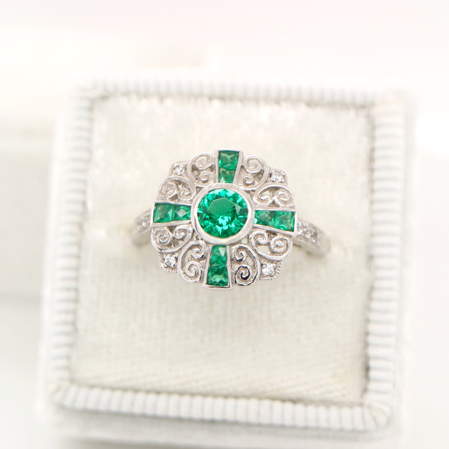 Filigree emerald and diamond ring in white gold