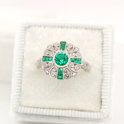 Filigree emerald and diamond ring in white gold