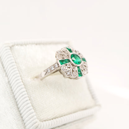 Filigree emerald and diamond ring in white gold