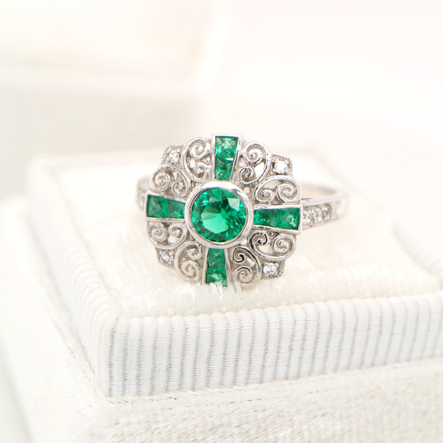 Filigree emerald and diamond ring in white gold