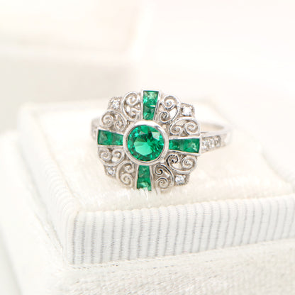 Filigree emerald and diamond ring in white gold