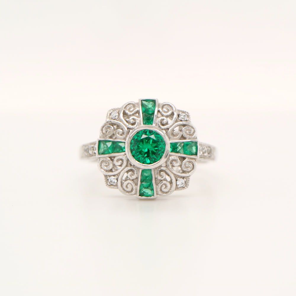 Filigree emerald and diamond ring in white gold