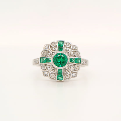 Filigree emerald and diamond ring in white gold