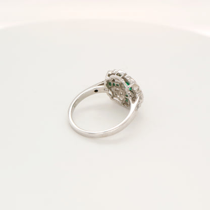 Filigree emerald and diamond ring in white gold