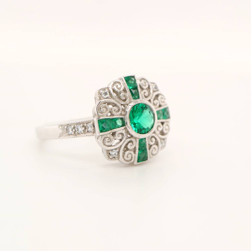 Filigree emerald and diamond ring in white gold