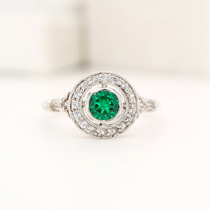 Laboratory grown emerald with CZ halo ring in sterling silver