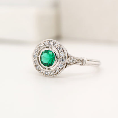 Laboratory grown emerald with CZ halo ring in sterling silver