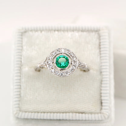 Laboratory grown emerald with CZ halo ring in sterling silver