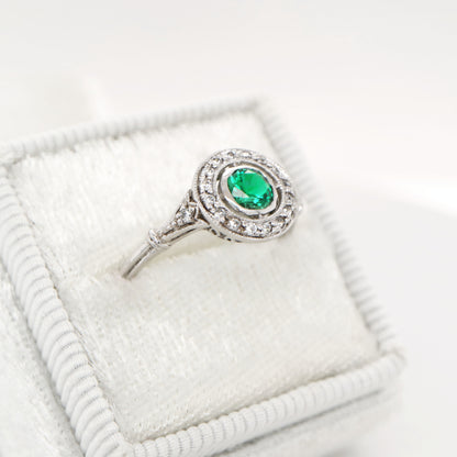 Laboratory grown emerald with CZ halo ring in sterling silver