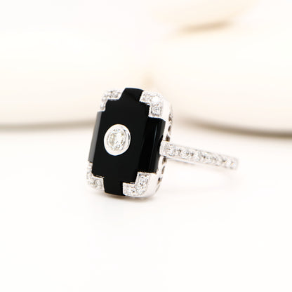 Art deco step cut ring with onyx and diamond in white gold