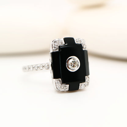 Art deco step cut ring with onyx and diamond in white gold