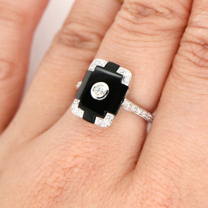 Art deco step cut ring with onyx and diamond in white gold