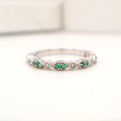 White gold, double emerald and diamond celebration band