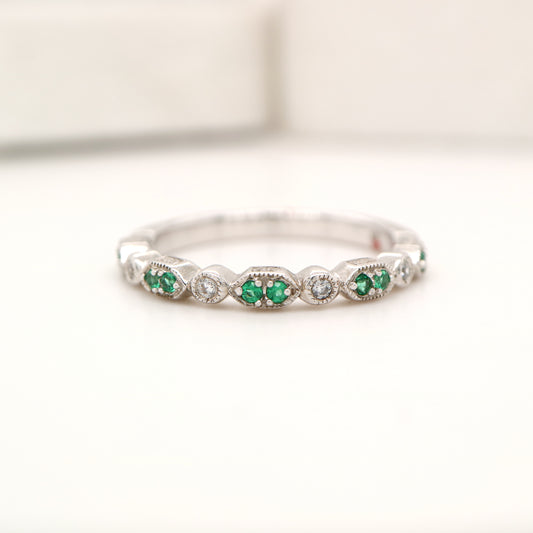 White gold, double emerald and diamond celebration band